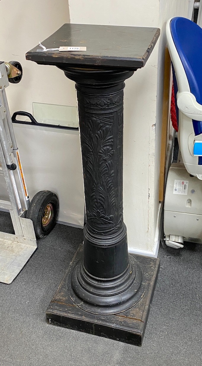 An ebonized and embossed leather covered pedestal, height 114cm.